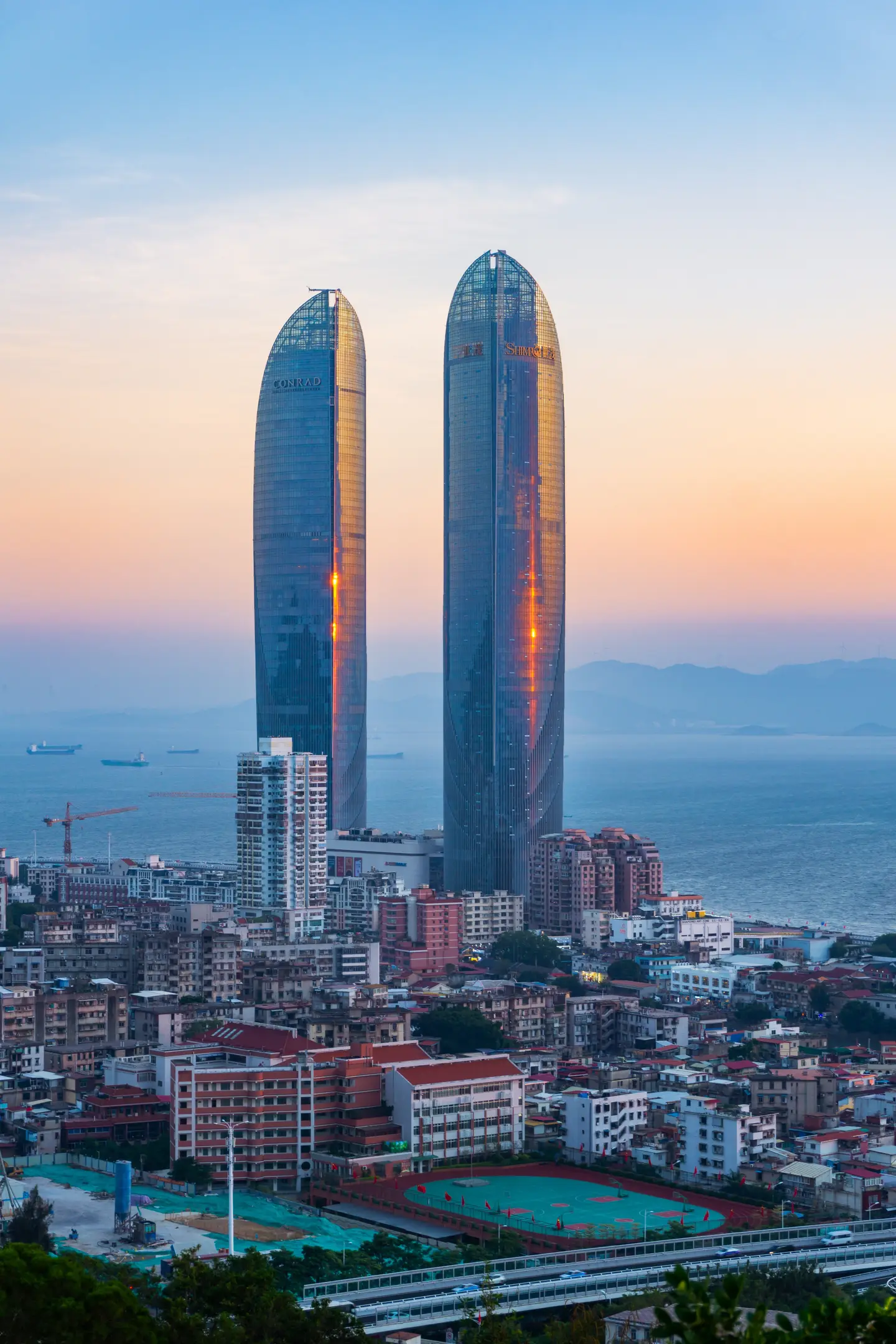 Xiamen waterfront and Shimao Straits Towers at dusk
